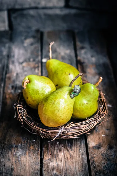 Pears on rustic wooden background — Stock Photo, Image