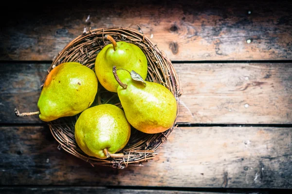 Pears on rustic wooden background — Stock Photo, Image