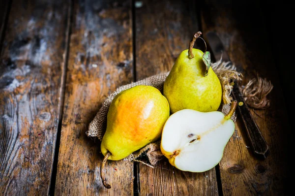 Pears on rustic wooden background — Stock Photo, Image