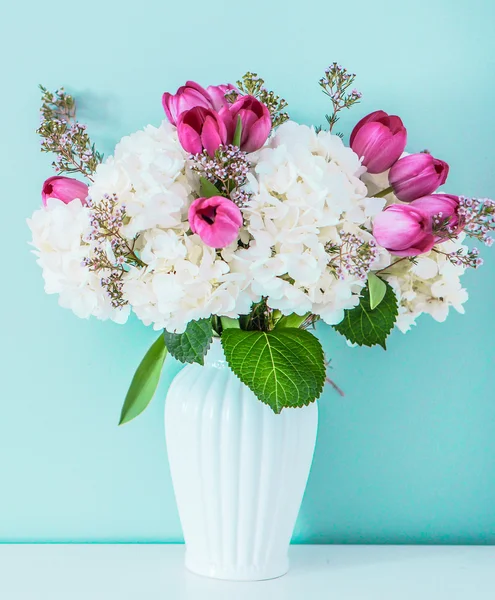 Spring bouquet on blue background — Stock Photo, Image