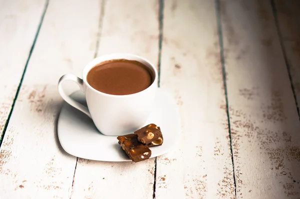 Cup of hot chocolate on wooden background — Stock Photo, Image