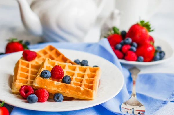Belgian waffles with berries on rustic background — Stock Photo, Image