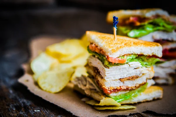 Club sandwich on rustic wooden background — Stock Photo, Image