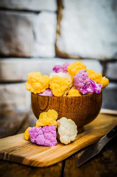 Colorful cauliflower on rustic background — Stock Photo, Image