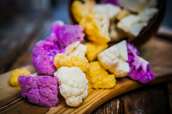 Colorful cauliflower on rustic background — Stock Photo, Image