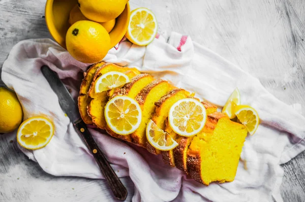 Lemon cake on rustic background — Stock Photo, Image