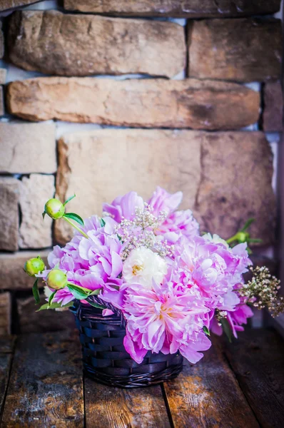 Peonies on rustic wooden background — Stock Photo, Image
