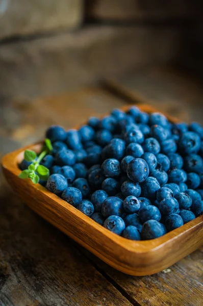 Blueberries on wooden background — Stock Photo, Image