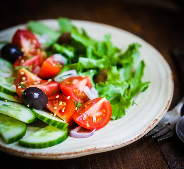 Vegetable salad on wooden background — Stock Photo, Image