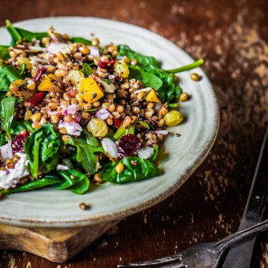 Healthy salad with spinach,quinoa and roasted vegetables clipart