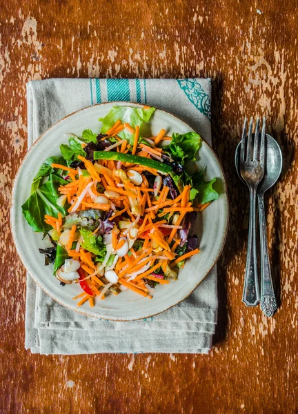 Healthy salad with carrot,almond and cheese