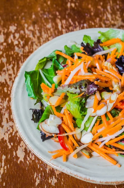 Healthy salad with carrot,almond and cheese — Stock Photo, Image