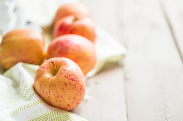 Apples on wooden background — Stock Photo, Image