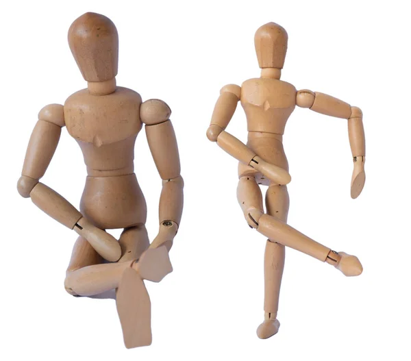  Wooden mannequin in different pose isolated on white.