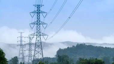 Power line pylon in mountainous area.