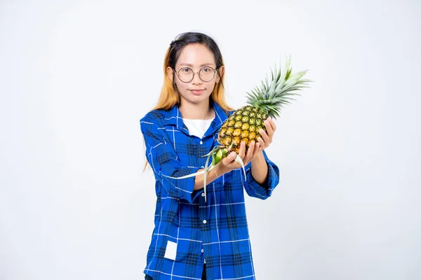 Young woman with pineapple isolated. Full isolated portrait of a beautiful caucasian woman with pineapple in white background