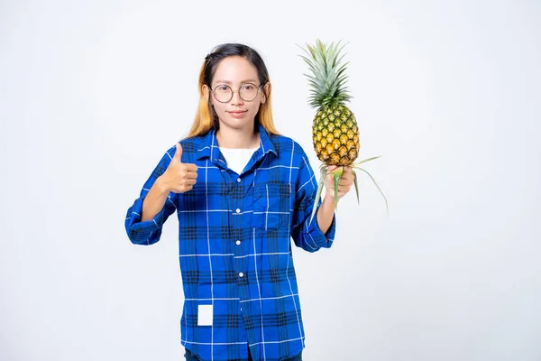 Young woman with pineapple isolated. Full isolated portrait of a beautiful caucasian woman with pineapple in white background
