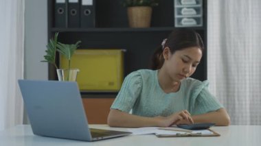 Asian woman working at home, working from home freelancer concept. teleconference online.