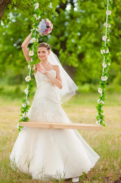 Bride on swing — Stock Photo, Image