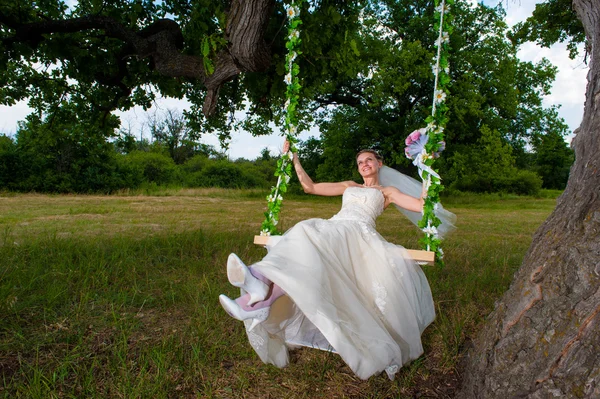 Bride on swing — Stock Photo, Image