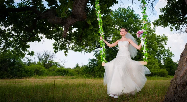 Bride on swing — Stock Photo, Image