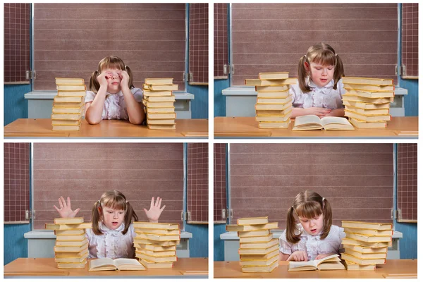 Schattig schoolmeisje bij een balie met boeken — Stockfoto