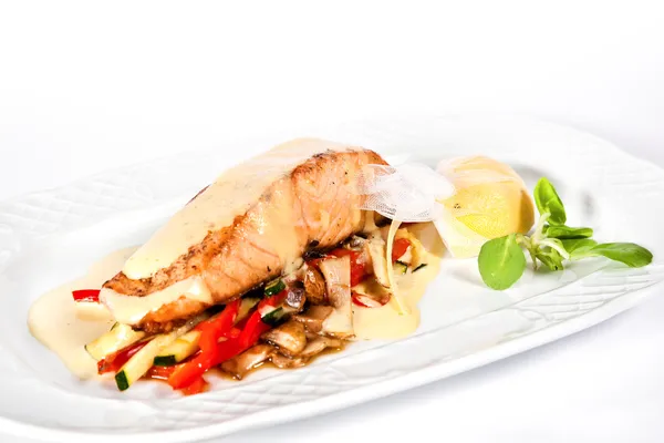Baked sea bass fillet with vegetables — Stock Photo, Image