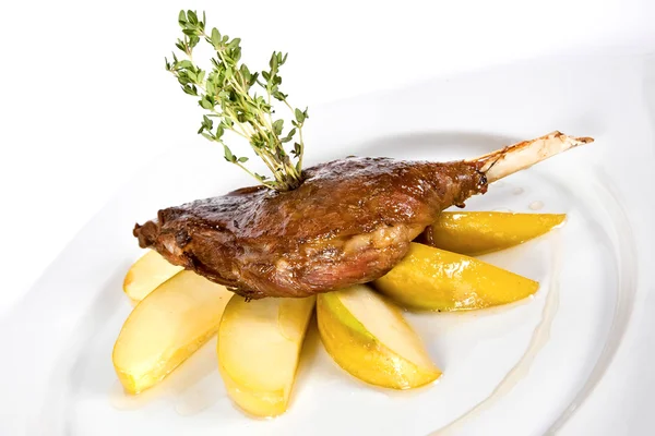 Duck leg with baked apples — Stock Photo, Image