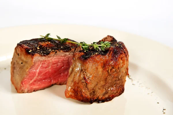 Filet mignon with rosemary twig — Stock Photo, Image