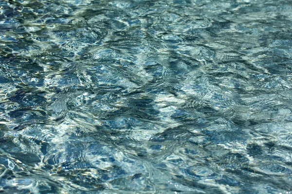 Water texture with ripples and waves — Stock Photo, Image