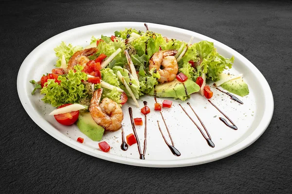 Salad Avocado Tiger Prawns Seasoned Pesto Sauce Isolated Black Background — стоковое фото