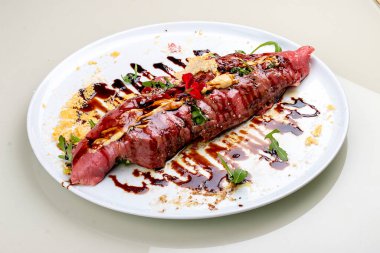 Raw beef tartare with parmesan cheese and wine sauce.