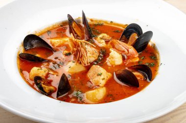 Spanish soup bouillabaisse with seafood, mussels, shrimps and scallop.