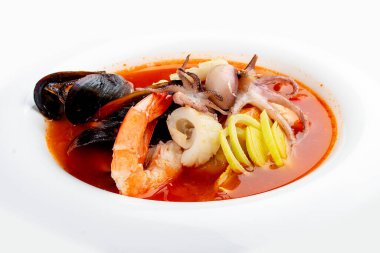 Traditional Marseille Bouillabaisse fish soup with prawns, mussels tomato,lobster, squid.