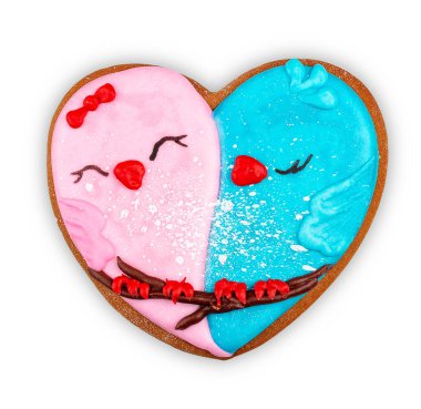 Gingerbread in the shape of a heart, with a picture of birds . Isolated on white background