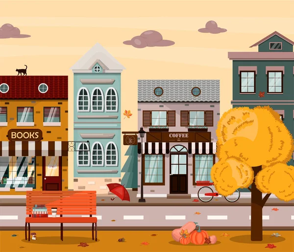 Rua de outono vetorial com casas, livraria, padaria, cafetaria. Ilustração plana da cidade no estilo europeu. Cidade de outono dos desenhos animados com um parque e abóboras —  Vetores de Stock