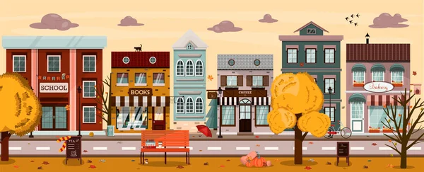 Rua de outono vetorial com casas, cafés, livraria, padaria, escola, cafetaria. Ilustração plana da cidade no estilo europeu. Cidade de outono dos desenhos animados com um parque e abóboras — Vetor de Stock