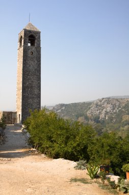The ancient watch tower in Pocitelj clipart