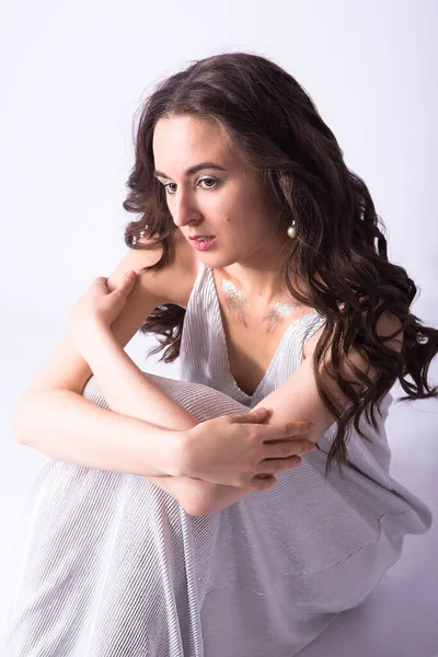 Sad Beautiful Young Woman Sitting Floor Dress Isolated White Background — Zdjęcie stockowe