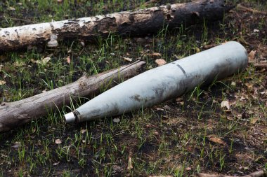 Kolonshchina, Kyiv region - April 21, 2022: Unexploded shells of the Russian multiple launch rocket system Uragan. War between Russia and Ukraine, April 21, 2022