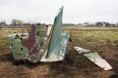 Andriivka, Kyiv region - April 21, 2022: Wreckage of a downed Russian military Su-25SM attack aircraft that bombed Ukrainian villages. War between Russia and Ukraine, April 21, 2022. clipart