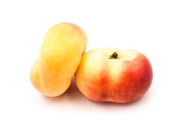Two ripe fresh organic fig peaches isolated on white background.