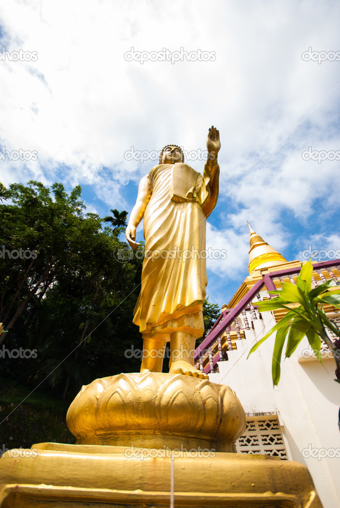 statue of monk walking