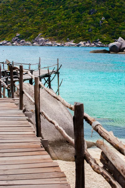 Blue Transparent Sea with wooden bridges — Stock Photo, Image