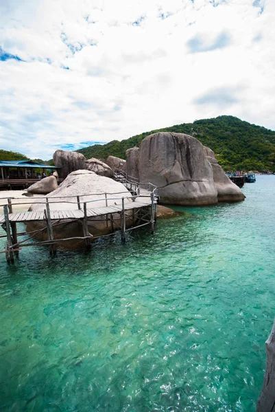 Wooden bridge with rock — Stock Photo, Image