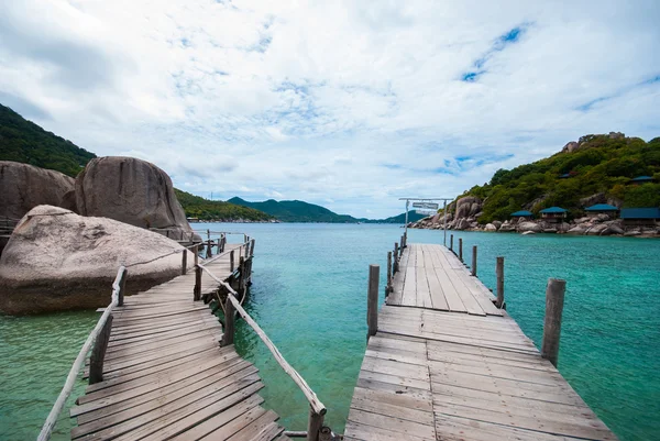 Wooden bridge with rock — Stock Photo, Image