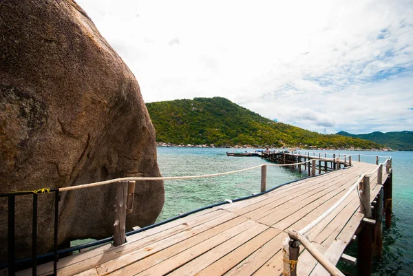 Wooden bridge with rock — Stock Photo, Image