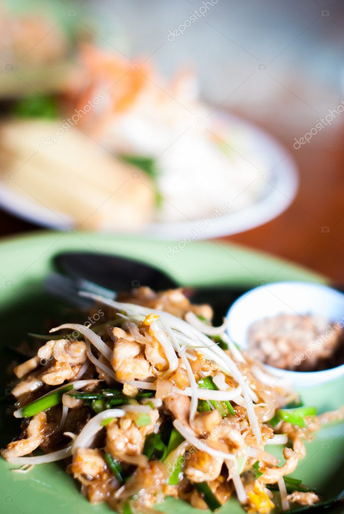 Pad thai with chicken and pork in dish