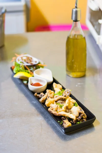 Fried octopus tentacles with sauces — Stock Photo, Image