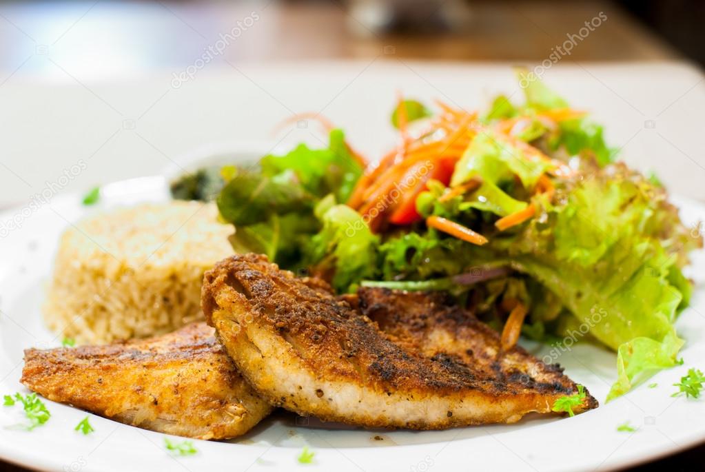 Fried Fish Steak with salad and fried rice